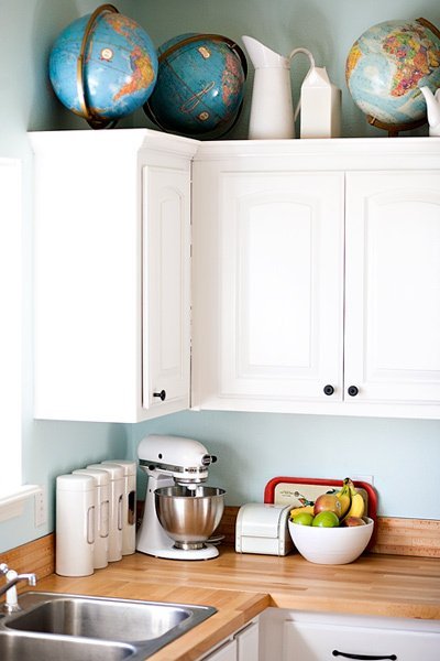 There's no better way to bring this much color and conversation to the kitchen with only a single, repeated, object. Long live globes — new, vintage, whatever! As long as you love 'em.
Design and photography by Ashley Ann Photography via Apartment Therapy
