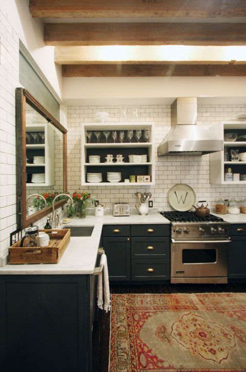 In 2016, Houzz predicts that kitchens will eschew the perfect, polished look for a more eclectic vibe. Instead of only incorporating one or two materials, homeowners will turn to a variety of opposing styles to create a truly personalized space. This Manhattan kitchen, which features a rustic wood ceiling, a white subway tile backsplash, a vintage inspired rug, and shiny white countertops, is a perfect example.