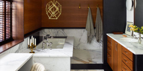 Proof that serious art looks great in bathrooms: This Harry Bertoia sculpture hangs above the tub in the master bath of a Greenwich Village townhouse designed by Joe D'Urso.