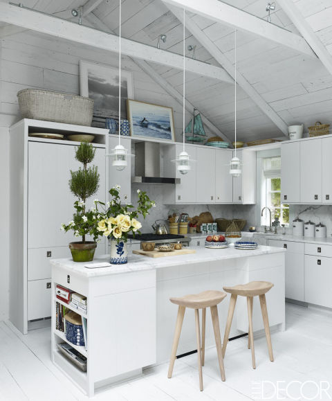 in this cheery hamptons home the kitchen cabinetry is custom made the stools are