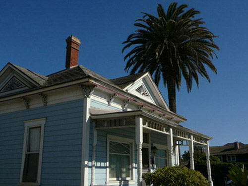 While many people may recognize this adorable two-bedroom Victorian cottage in Oceanside, California as the home of Kelly McGillis' character Charlie from the Tom Cruise flick Top Gun, the property has an interesting and storied past. It was built in 1887 by a man named Dr. Henry Graves, and according to an article on Zillow.com, it's one of the oldest beach cottages in San Diego County. The home was declared a historic property in 2005; the city of Oceanside has approved a $209 million dollar luxury hotel project set to break ground next year that will incorporate the recently restored bungalow perhaps as a gift store or coffee shop, according to the U-T San Diego.