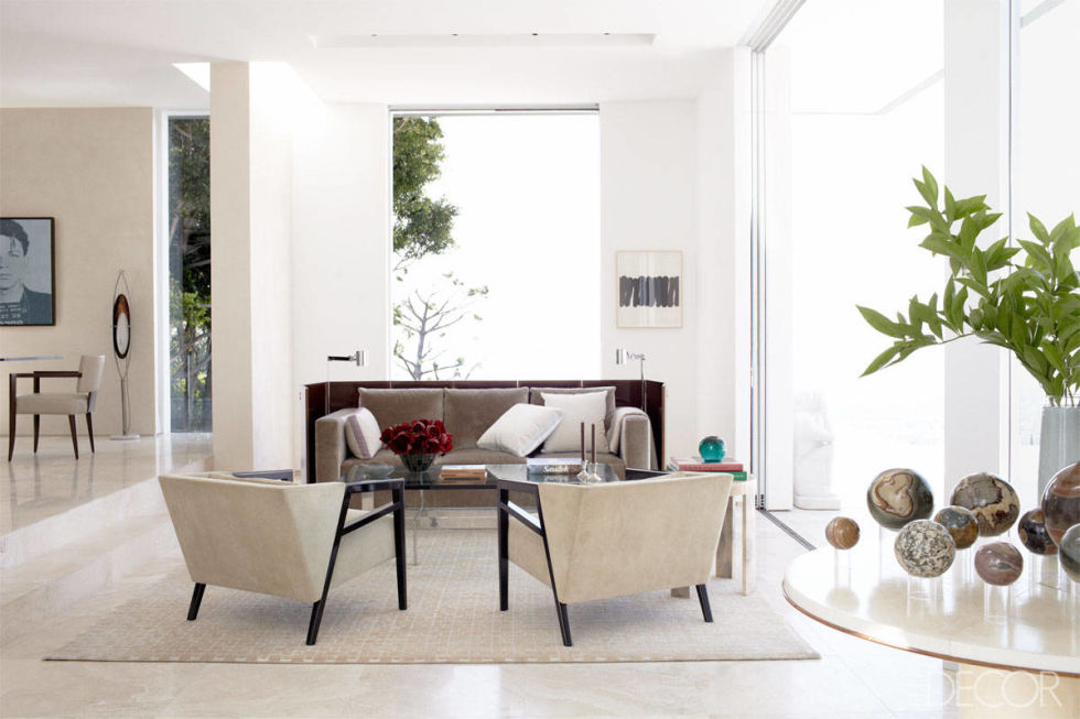 Furniture placement can be tricky in a room without much wall space. In the family room, designer Chad Eisner pulled the furniture into the middle of the room and designed a screen that "wraps" the sofa and anchors a desk behind it.
Tour the home that inspired this solution
