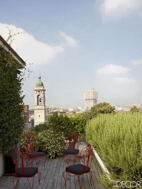 I continue to make tweaks, rearranging furniture and adding new chairs as my whims change. And although we all love neat, happy endings, my husband and I are currently engaged in a full terrace renovation to repair a leaking floor, among other homeowner snafus. The familiar Italian-style chaos of no timetables, insecure budgets, canceled meetings, and no note-taking is with us once again. But this time, I plan to fully flirt my way through the entire project.   The terrace, planted with jasmine and rosemary, offers a view of the 16th-century Chiesa di San Barnaba e Paolo and the 1950s Torre Velasca; Martin found the chairs at a local junkyard.  PUBLISHED IN ELLE DECOR ITALIA AND ELLE DECORATION CHINA. 